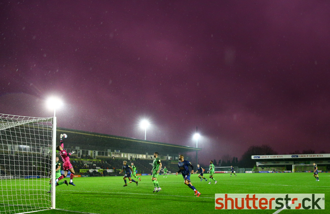 A general view of the action under stormy skies